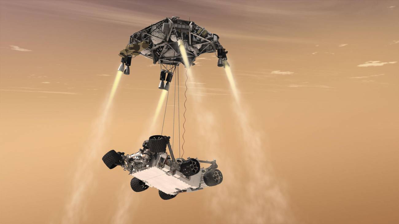 Recreación del sistema de grúas (skycrane) depositando el rover en el suelo marciano. / NASA/JPL