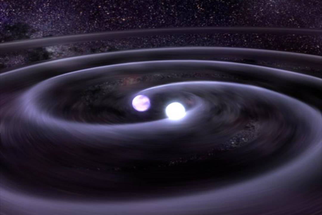 Las estrellas de un sistema binario se acercan por la emisión de ondas gravitatorias