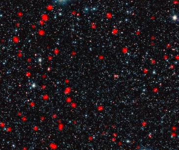 Galaxias distantes con estrellas en  formación en el universo temprano. Imagen: ESO, APEX, A. Weiss et al., NASA Spitzer S.C.