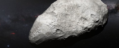 <p>Esta ilustración muestra al asteroide 2004 EW95, el primer asteroide rico en carbono confirmado en el cinturón de Kuiper y una reliquia del sistema solar primordial. / ESO/M. Kornmesser</p>