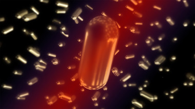 <p>Ilustración del efecto de la irradiación con un láser ultrarrápido sobre la uniformidad de nanopartículas de oro. Dentro del haz láser (en rojo), todas las partículas se hacen iguales y aparecen con aspecto brillante, mientras que las no iluminadas presentan pequeñas diferencias (y aparecen ligeramente difuminadas). / CIC biomaGUNE/UCM/UPM</p>