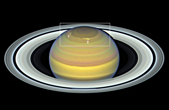 <p>Dos tormentas (numeradas como 1 y 2) captadas en la región polar norte de Saturno por el telescopio espacial Hubble el 6 de junio de 2018. / NASA/ESA et al.</p>